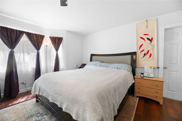 bedroom featuring wood finished floors