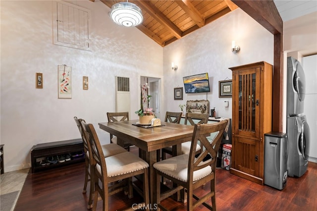 dining area featuring dark wood-style floors, stacked washer / drying machine, wooden ceiling, and beamed ceiling