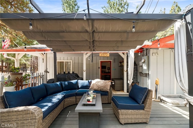 wooden deck featuring an outdoor living space