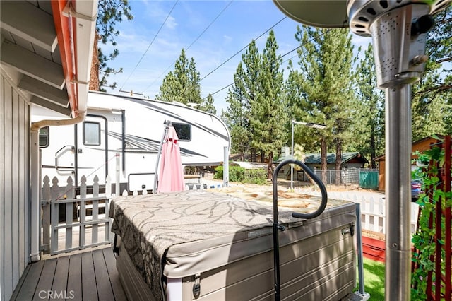 deck with outdoor dining area and fence