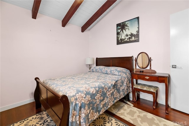 bedroom featuring wood ceiling, lofted ceiling with beams, baseboards, and wood finished floors