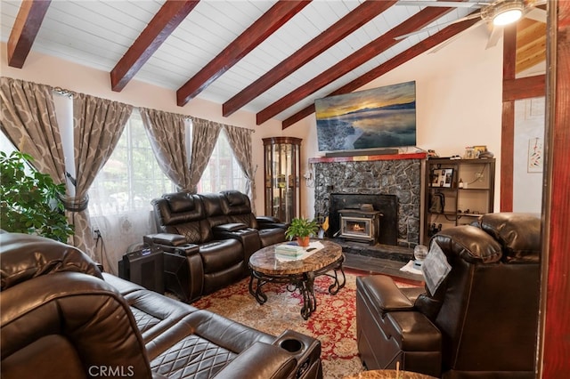 living room featuring vaulted ceiling with beams, a ceiling fan, and wood finished floors