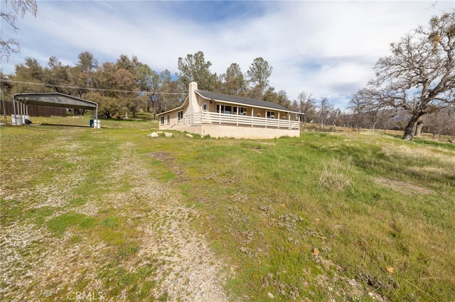 back of property with a chimney