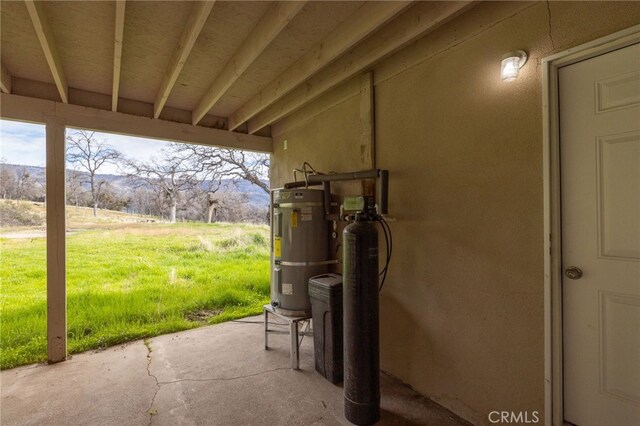 view of patio featuring water heater