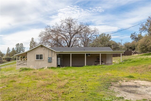 back of property with stucco siding