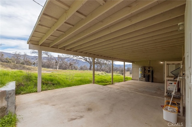 view of patio featuring gas water heater and a mountain view