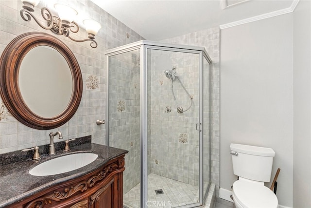 full bathroom with toilet, a stall shower, ornamental molding, and vanity