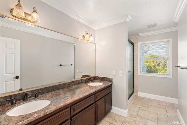 full bath with crown molding, baseboards, and a sink