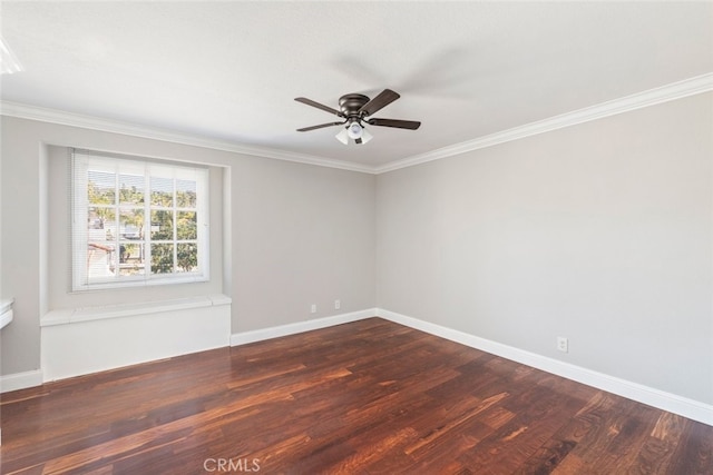 empty room featuring crown molding, baseboards, and wood finished floors