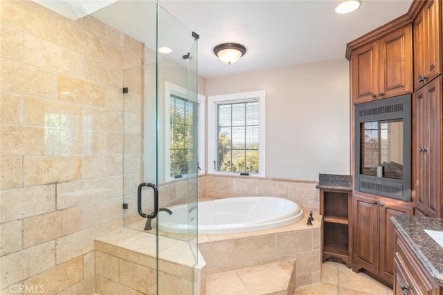 bathroom featuring a bath, a shower stall, vanity, and recessed lighting