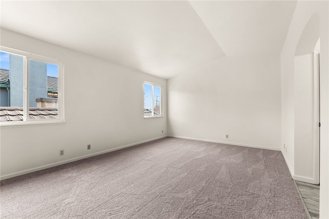 empty room with baseboards and carpet flooring