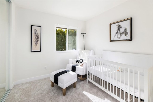 bedroom featuring carpet floors and baseboards