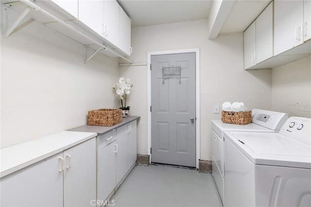 laundry room featuring cabinet space and independent washer and dryer