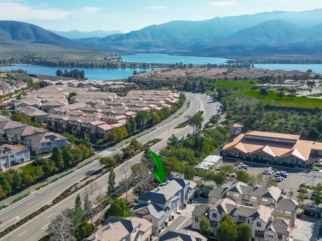 aerial view featuring a residential view and a water and mountain view