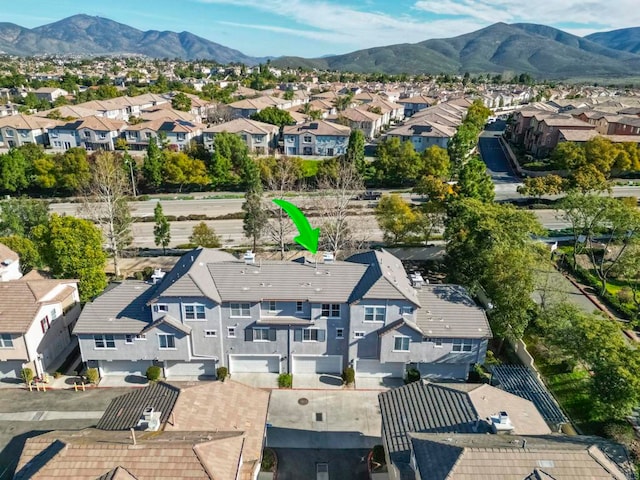 birds eye view of property featuring a residential view and a mountain view