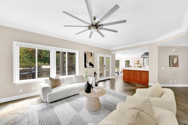 living room featuring french doors, a wealth of natural light, and baseboards