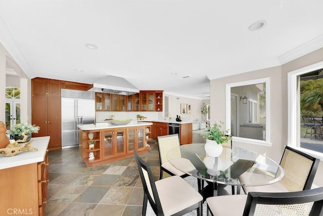 dining space featuring crown molding and recessed lighting