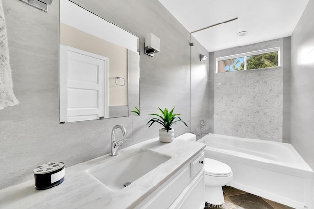 full bath featuring toilet, tasteful backsplash,  shower combination, and vanity