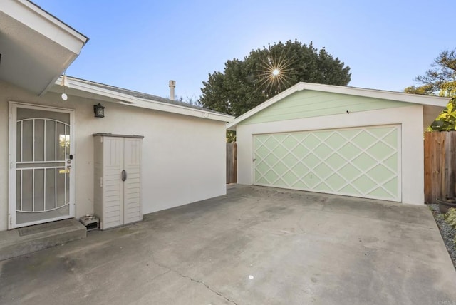 garage featuring fence