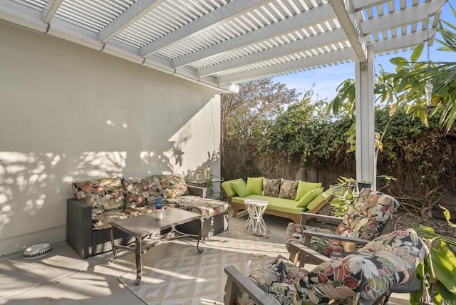 view of patio with outdoor lounge area, fence, and a pergola