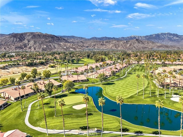 birds eye view of property featuring a residential view, view of golf course, and a water and mountain view