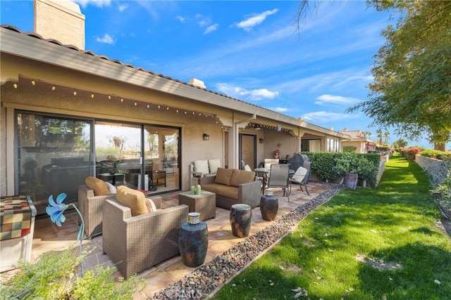 rear view of house with a chimney, a lawn, a patio area, and an outdoor living space