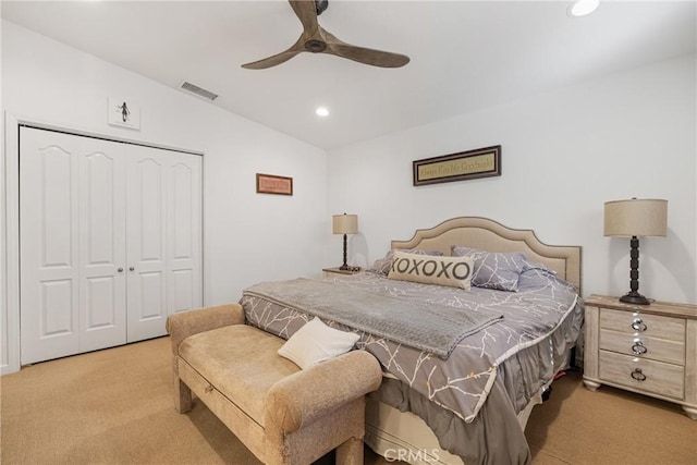 bedroom featuring lofted ceiling, recessed lighting, carpet flooring, visible vents, and a closet