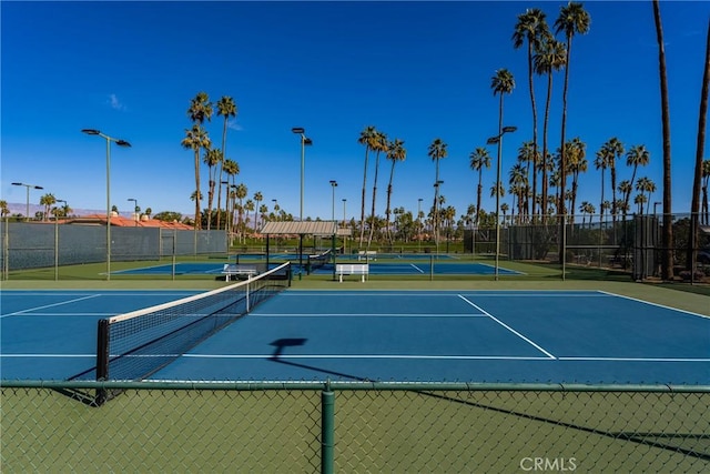 view of tennis court with fence