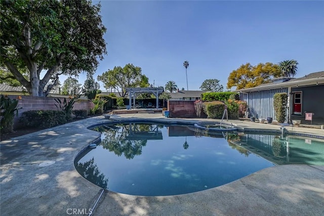 view of swimming pool with a patio area, fence, a pool with connected hot tub, and a pergola