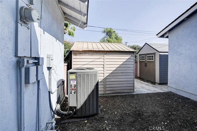 view of shed with central air condition unit