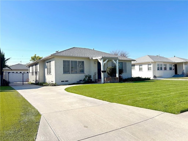 view of front facade with driveway, crawl space, roof with shingles, stucco siding, and a front lawn