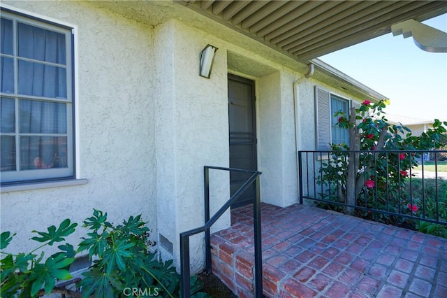 exterior space with stucco siding