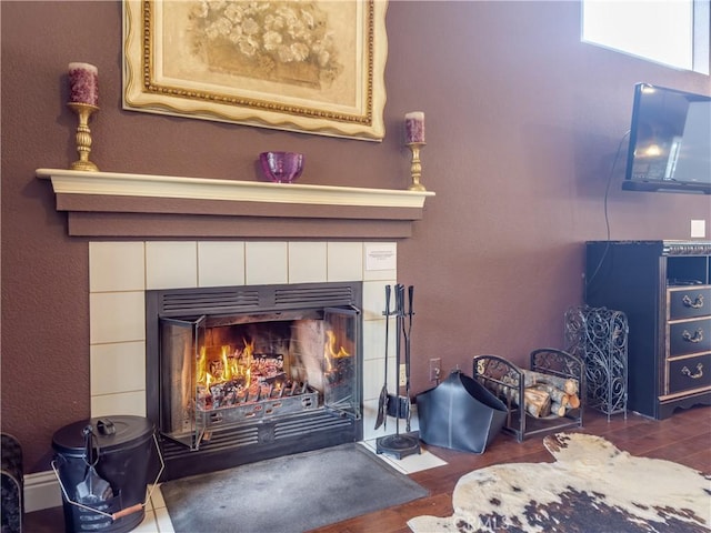 room details with a fireplace and wood finished floors