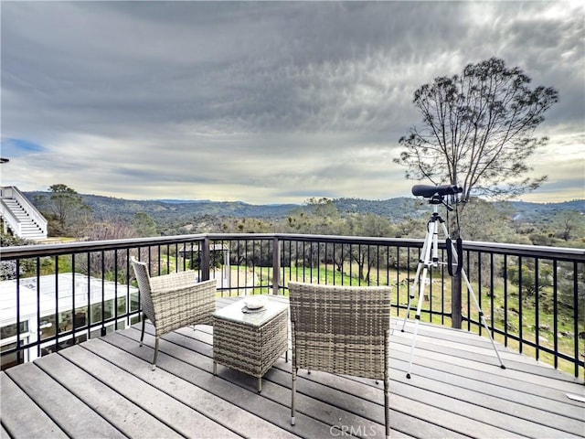 wooden terrace featuring a mountain view