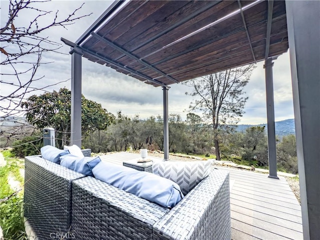 wooden terrace featuring an outdoor hangout area