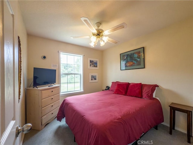 carpeted bedroom featuring a ceiling fan