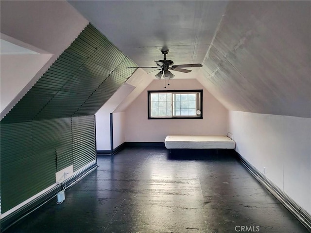 bonus room featuring lofted ceiling, ceiling fan, and baseboards