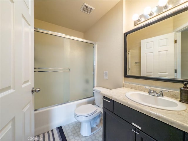 bathroom with toilet, vanity, visible vents, and enclosed tub / shower combo