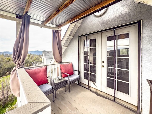 exterior space featuring french doors and a mountain view