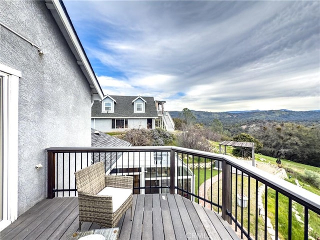 wooden deck featuring a mountain view