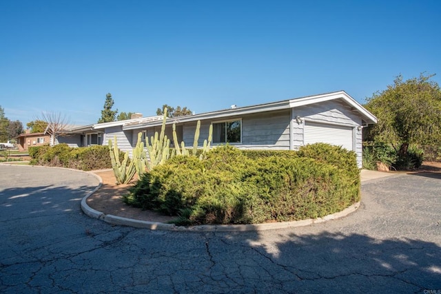 single story home featuring an attached garage