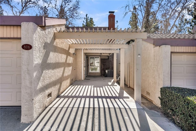 view of exterior entry with crawl space, a chimney, central AC unit, and stucco siding