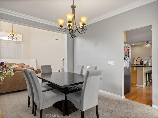 30514 Sorrento Pl, Castaic, CA 91384 - dining room featuring a chandelier, crown molding, carpet floors, and a ceiling fan