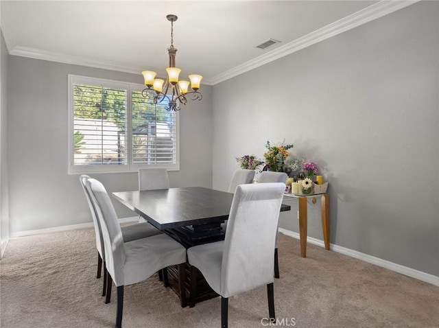 carpeted dining area with a chandelier, ornamental molding, visible vents, and baseboards