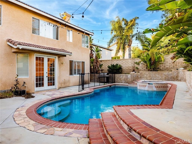 30514 Sorrento Pl, Castaic, CA 91384 - view of swimming pool with french doors, a fenced backyard, a patio area, and a pool with connected hot tub