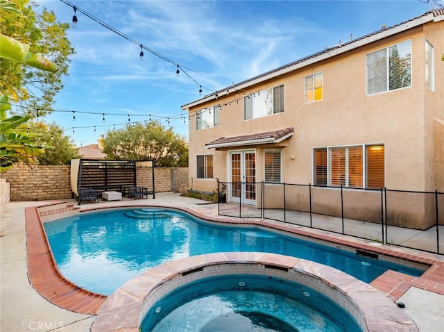 30514 Sorrento Pl, Castaic, CA 91384 - view of swimming pool featuring french doors, a pool with connected hot tub, a fenced backyard, and a patio