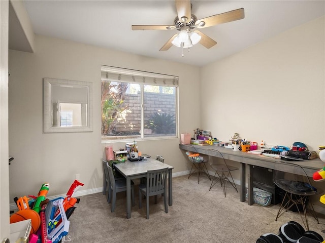 game room with carpet floors, baseboards, and a ceiling fan