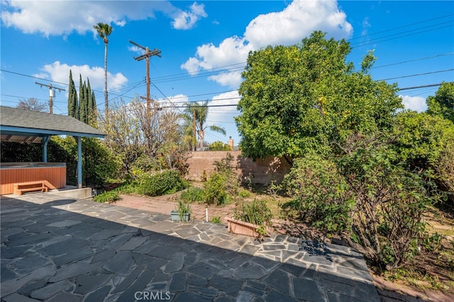 view of patio featuring a hot tub