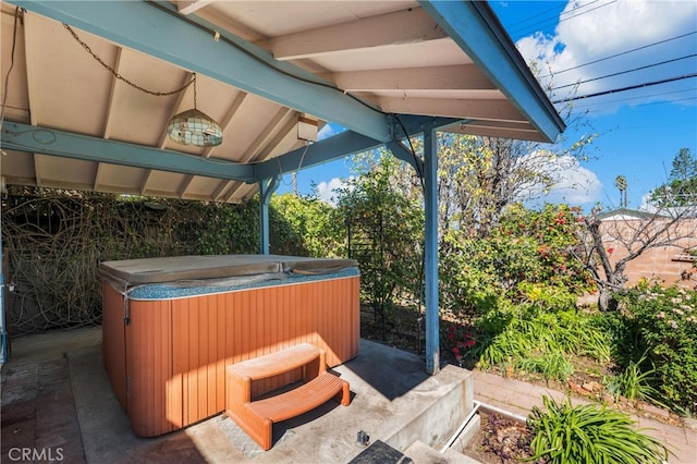 view of patio with a hot tub