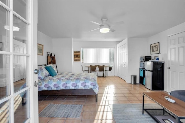 bedroom featuring light tile patterned floors and french doors